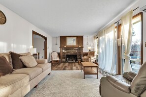 TV, fireplace, books