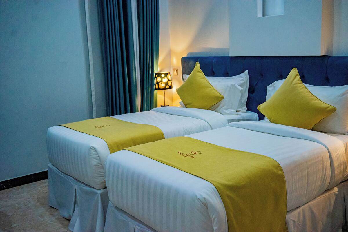 Twin Room | Iron/ironing board, WiFi (free), bed sheets