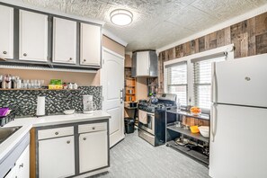 Fridge, microwave, coffee/tea maker, cookware/dishes/utensils