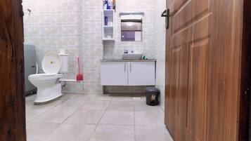 Bidet, towels, soap, toilet paper