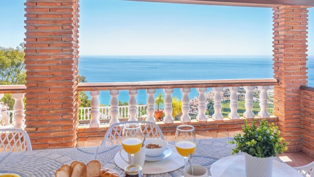 A table set for breakfast with a view of the sea. - Villa Vistas Nerja by Ruralidays (Málaga)
