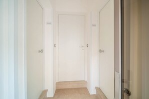 A hallway with a door labeled 'Master' and 'Bedroom.'