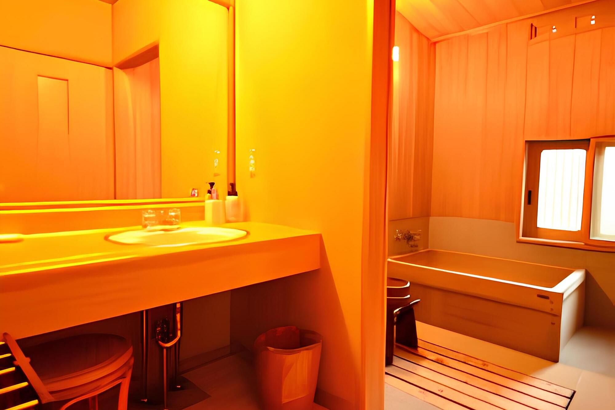 A bathroom with a wooden vanity, a sink, and a bathtub.