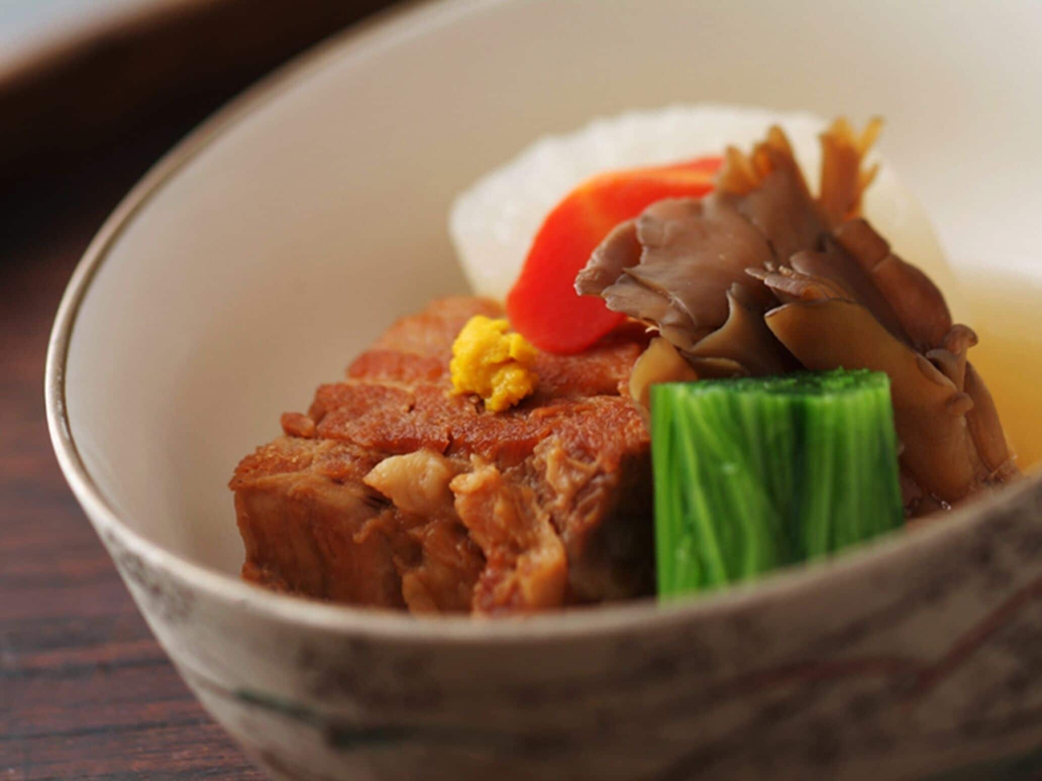 A bowl of food with various ingredients.