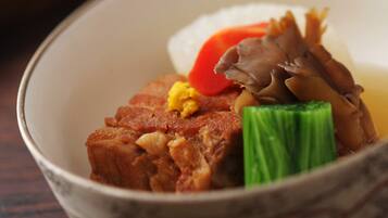 A bowl of food with various ingredients.