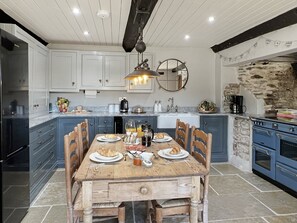 Microwave, oven, dishwasher, dining tables