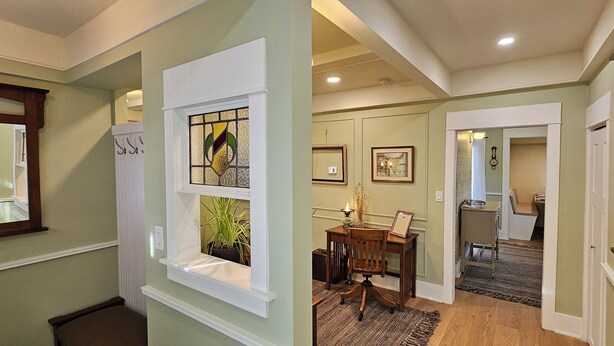 A hallway with a window, a door, and a staircase. - Stay Downtown in one of Princeton's historical homes, The Burr House (Princeton)