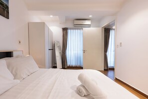 Apartamento família, sacada | 2 quartos, ferros/tábuas de passar roupa, Wi-Fi de cortesia