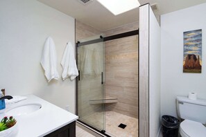 Shower, hair dryer, towels, shampoo
