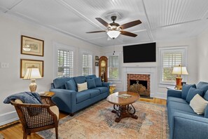 Smart TV, fireplace, books