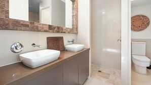 A modern bathroom with two sinks, a large mirror, and a shower. - Tranquil Beach Side Retreat - Inquire 4 Long Stay Discounts (Mount Coolum)