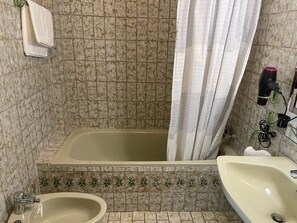 Hair dryer, bidet, towels, toilet paper