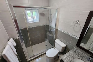 Shower, jetted tub, towels, soap