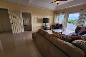 Living area - Stair Way To Tranquil Living 2bd/2.5bth with pool (Kingston)