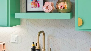A kitchen with teal cabinetry, a herringbone tile backsplash, a stainless steel sink, and a toaster on the counter. - Barbie Dream Condo - Near Restaurants, Coffee & Bar (Nashville)