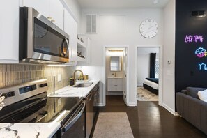 Fridge, microwave, oven, stovetop - Vibrant Neon Condo Near Restaurants, Coffee & Bars (Nashville)