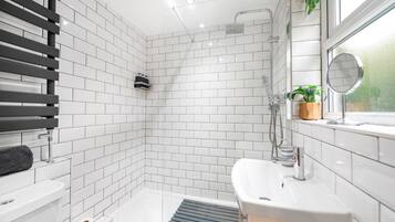 Shower, hair dryer, towels, toilet paper