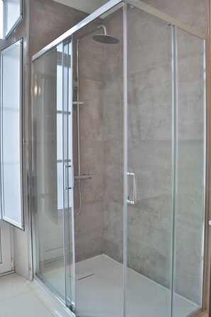 Shower, hair dryer, towels, soap
