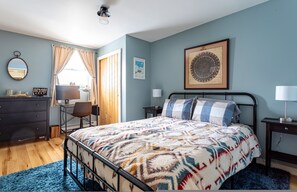 A bedroom with a bed, a desk, a chair, a dresser, and a framed picture on the wall. - Ski Hike Lodge 5BR w Fire Pit Cozy Spaces (Maplecrest)