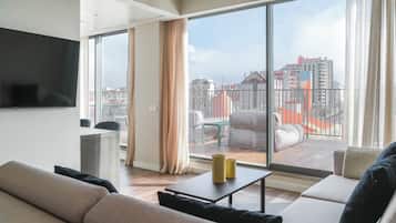 One-Bedroom Apartment, Private Terrace | Living area | 55-inch flat-screen TV with cable channels