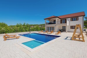 A two-story house with a swimming pool, sun loungers, and a wooden swing set. - Villa Peaceful Oasis Vignani (Imotski)