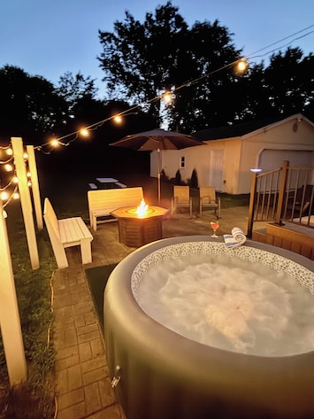 PATIO with Night Lighting, HOT TUB, Gas FIRE TABLE, Bench Seating, & Chairs