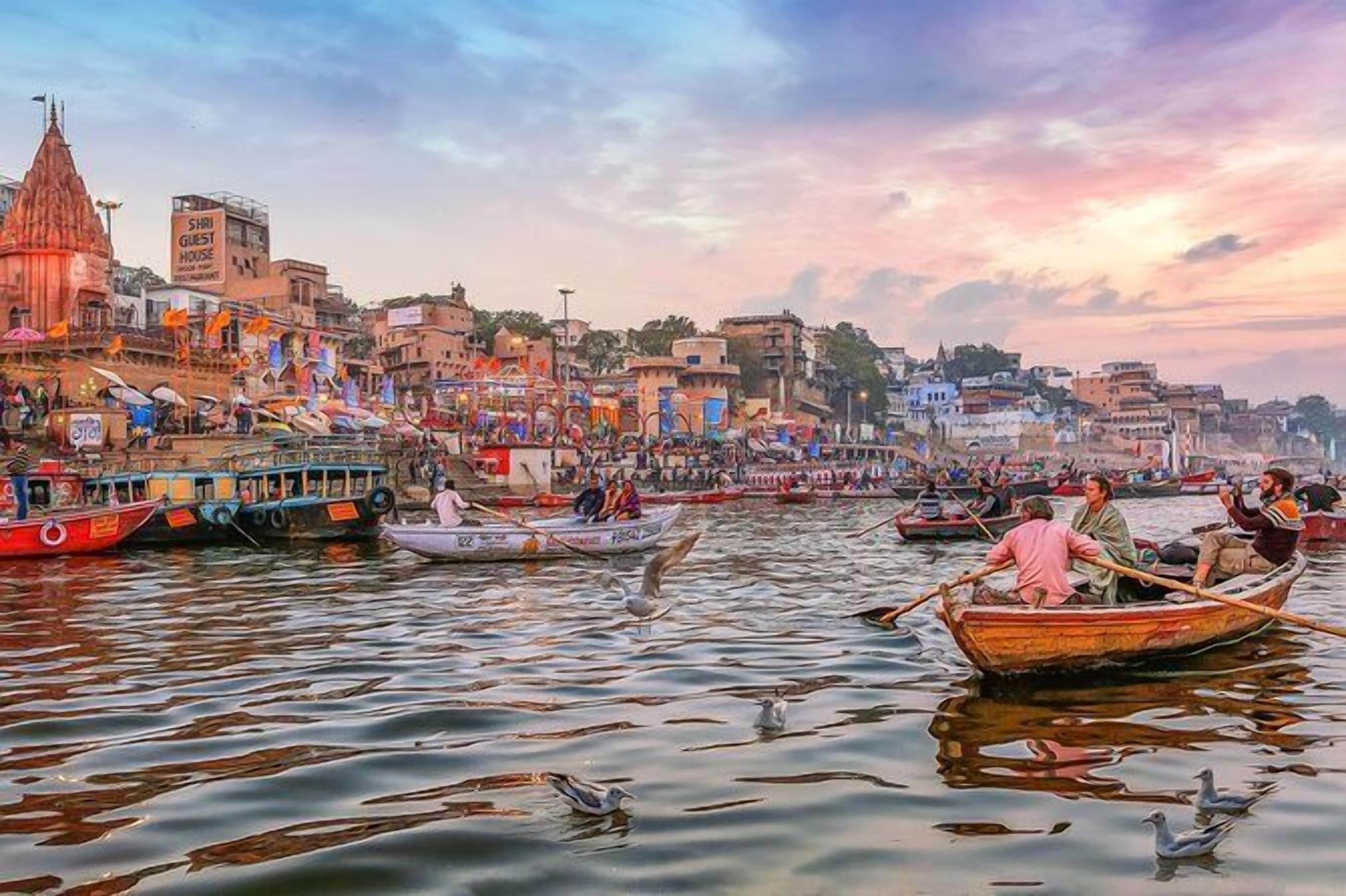 A river with boats and a temple on the left.