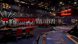 A casino with multiple blackjack tables, slot machines, and a neon sign for the cashier. - Luxury apartment in Opatija for 8 people with pool and silk bedding (Opatija)