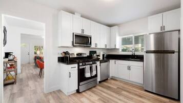 Fridge, microwave, dishwasher, cookware/dishes/utensils