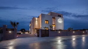 A modern two-story building with a prominent sign reading "MALIBU". - Malibu Eclipse (Vir)