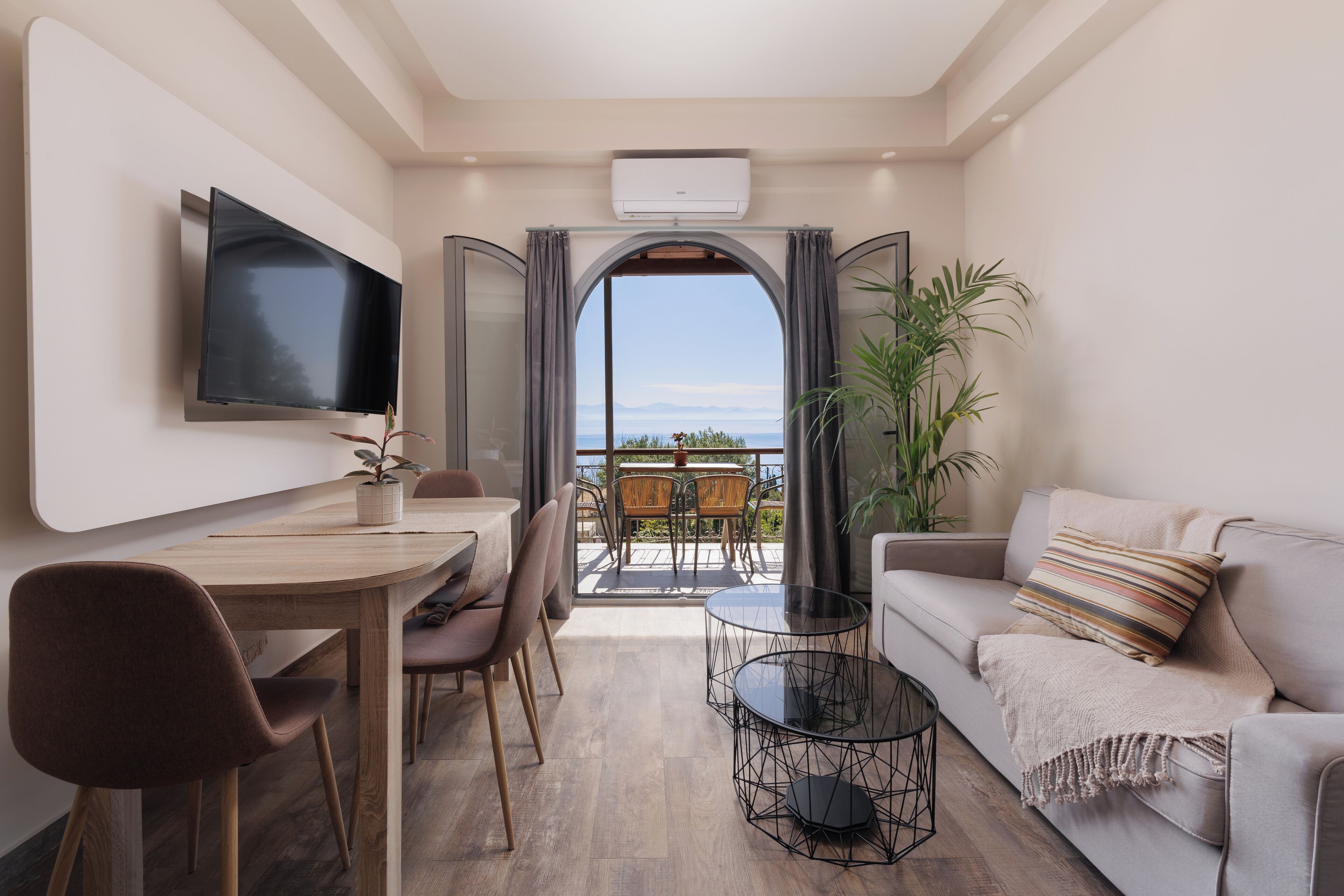 Comfort Apartment, 2 Bedrooms, Sea View | Living area | 50-inch flat-screen TV with satellite channels