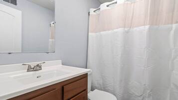 Shower, hair dryer, towels, shampoo