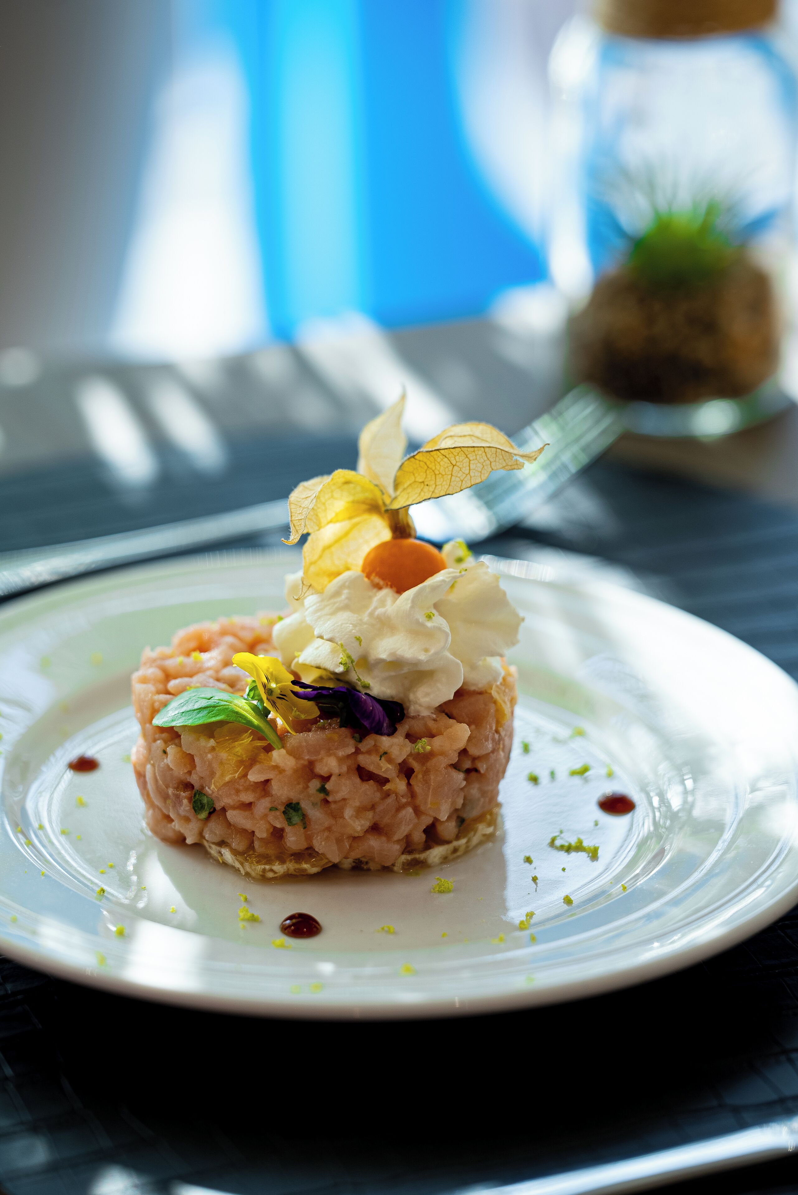 A plate of food with a garnish on top.