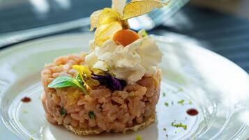 A plate of food with a garnish on top.