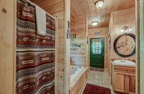 Shower, jetted tub, towels, soap