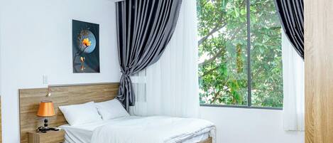 Chambre Double Deluxe | Literie de qualité supérieure, couette en duvet d'oie