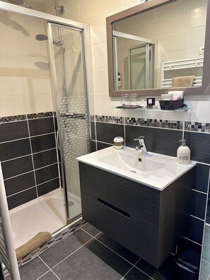 Shower, hair dryer, towels, soap