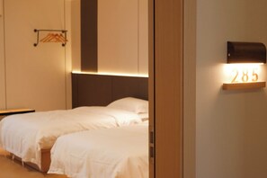 Premium bedding, down duvets, memory-foam beds, desk