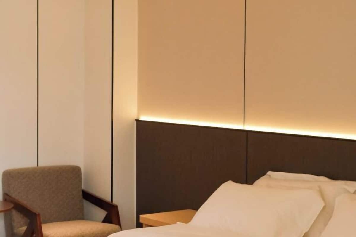 Premium bedding, down duvets, memory-foam beds, desk