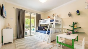 A child's room with bunk beds, a desk, and toys. - Fabulous Disney Vacation Home - 8bd - Private Pool w SPA - Near to Disney (Kissimmee)