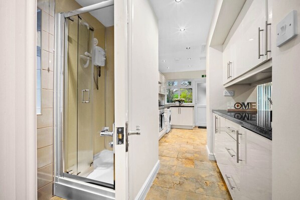 Shower, towels, soap, toilet paper