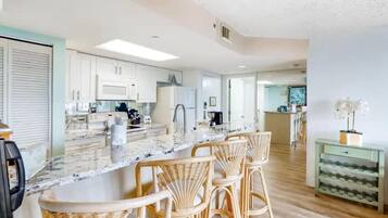 Fridge, microwave, coffee/tea maker, cookware/dishes/utensils