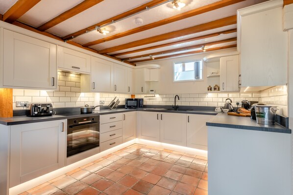 Fridge, microwave, oven, cookware/dishes/utensils