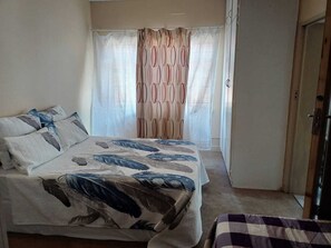 1 bedroom, desk, iron/ironing board, travel crib