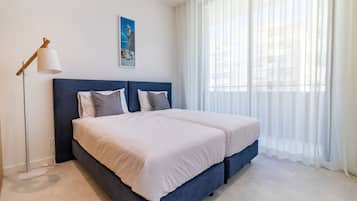 2 chambres, lits bébé (en supplément), draps fournis
