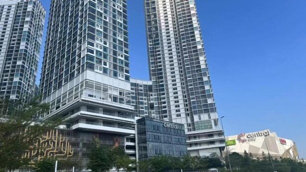 A high-rise building with multiple floors, large windows, and a modern architectural design. - I Soho at I City by My Trip & My Stay (Shah Alam)