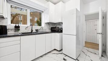 Fridge, microwave, stovetop, coffee/tea maker