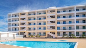 A multi-story hotel with a swimming pool, balconies, and a modern architectural design. - Lagos Marina View 2 With Pool by Homing (Lagos)