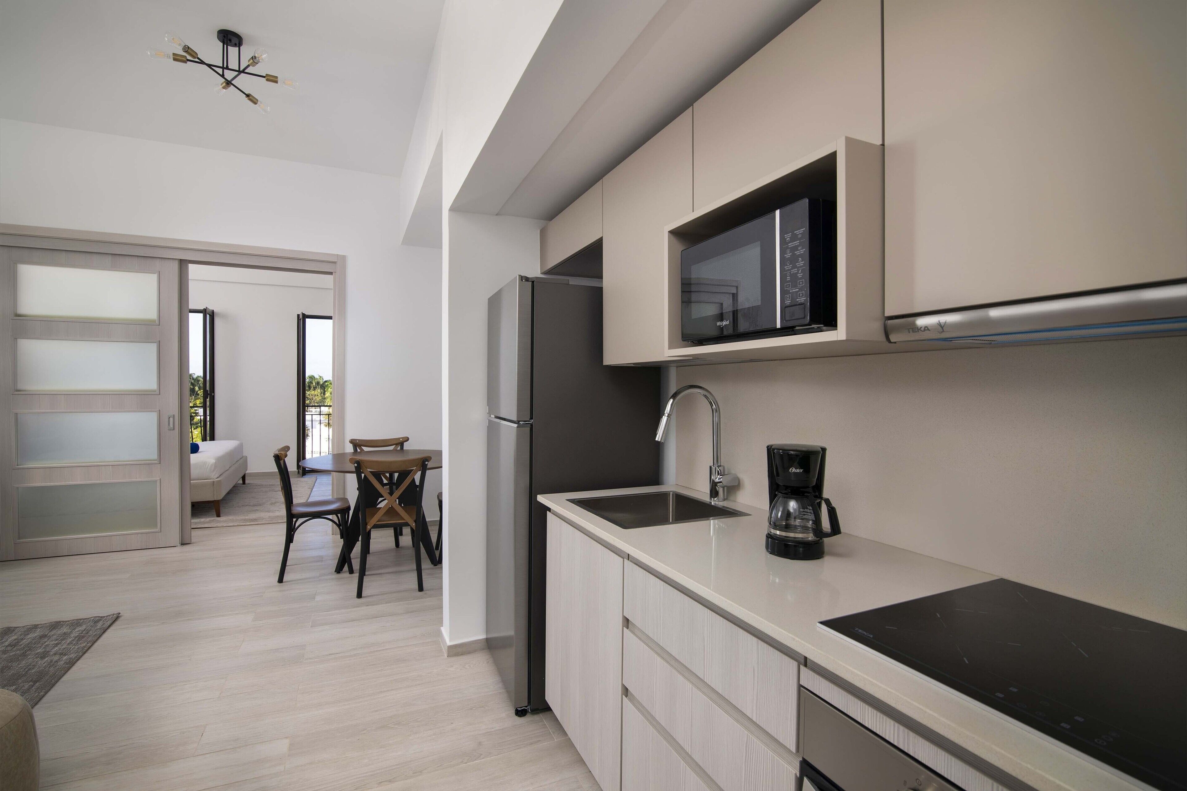 One Bedroom Deluxe | Private kitchen | Full-size fridge, microwave, coffee/tea maker, cookware/dishes/utensils