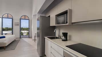 Microwave, cookware/dishes/utensils, dining tables